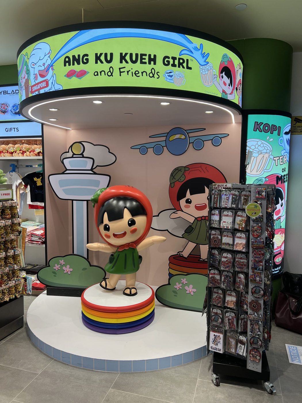 Sculpted Ang Ku Kueh Girl installed in a Changi Airport terminal retail space